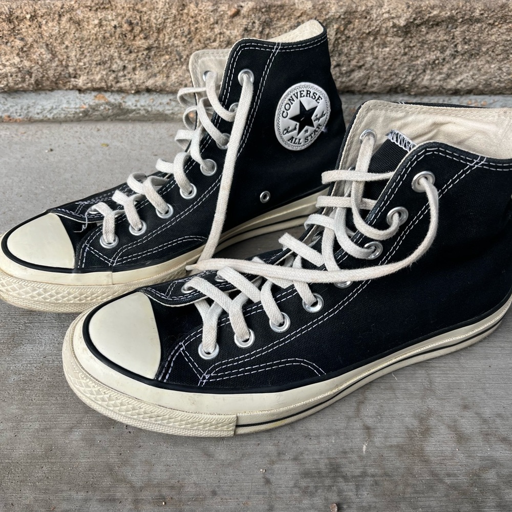 Black high-top Converse Chuck Taylor Sneakers